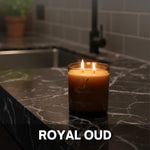 Royal Oud scented candle in a decorative glass jar رويال عود - شمعة